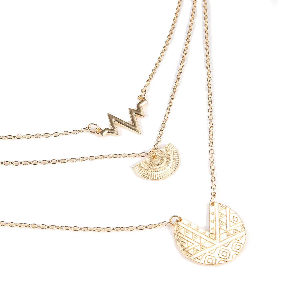 Gold multi-layer round alloy necklace with electroplated finish on white background