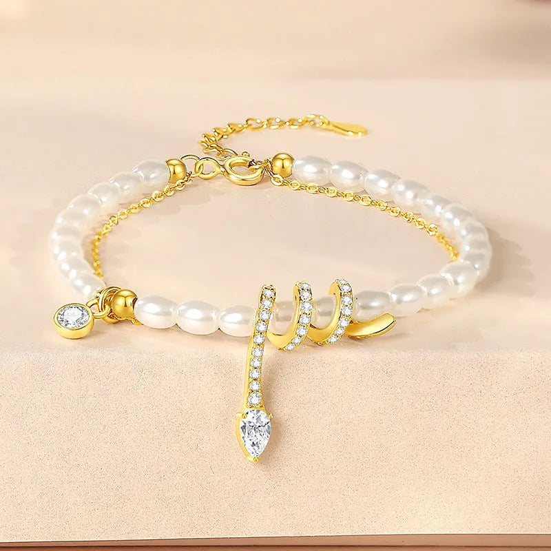 Snake beaded bracelet in 925 silver with electroplated gold finish and geometric zodiac design