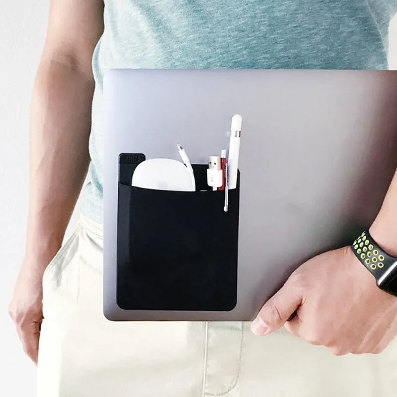 Black self-adhesive Lycra storage bag attached to back of laptop, 15x12cm, with pen loop and earphones visible