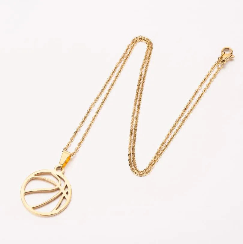 Gold stainless steel volleyball pendant necklace on display with chain and 3cm extender