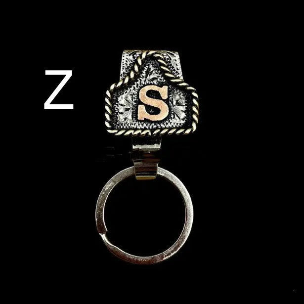 Handmade stainless steel cow tag belt key holder with engraved number plate on a split ring.