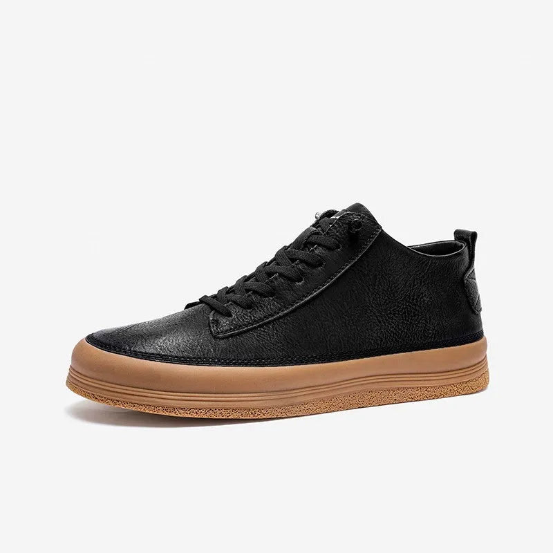 Men's black casual leather shoes with a round toe and white rubber sole on a plain background.