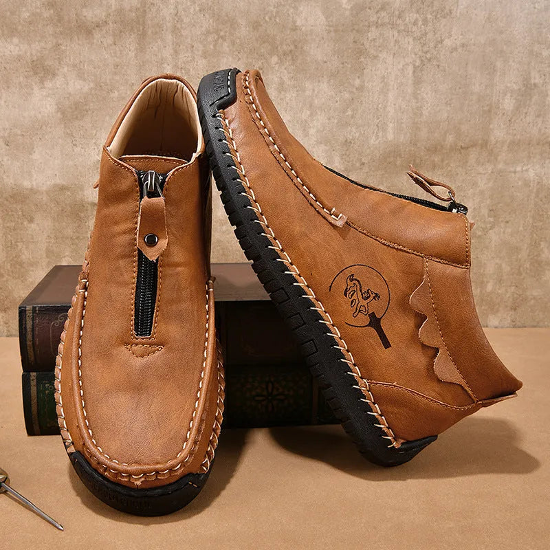 Men's black slip-on casual loafers with a round toe and rubber sole, shown from the side.