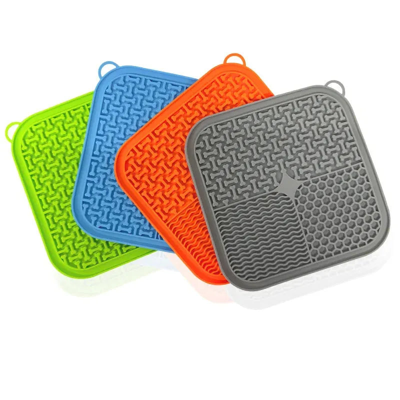 Blue silicone dog licking mat with textured pattern and suction cups on the back.