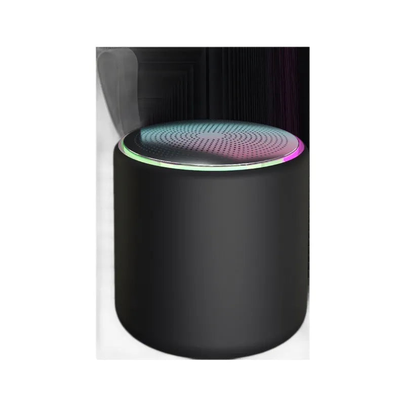 Bluetooth mini portable speaker in black with charging cable