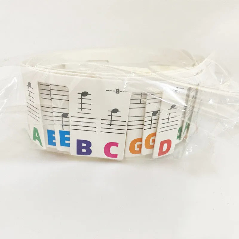 White cardboard piano keyboard stickers for 88-key staff notation learning with coloured note bars
