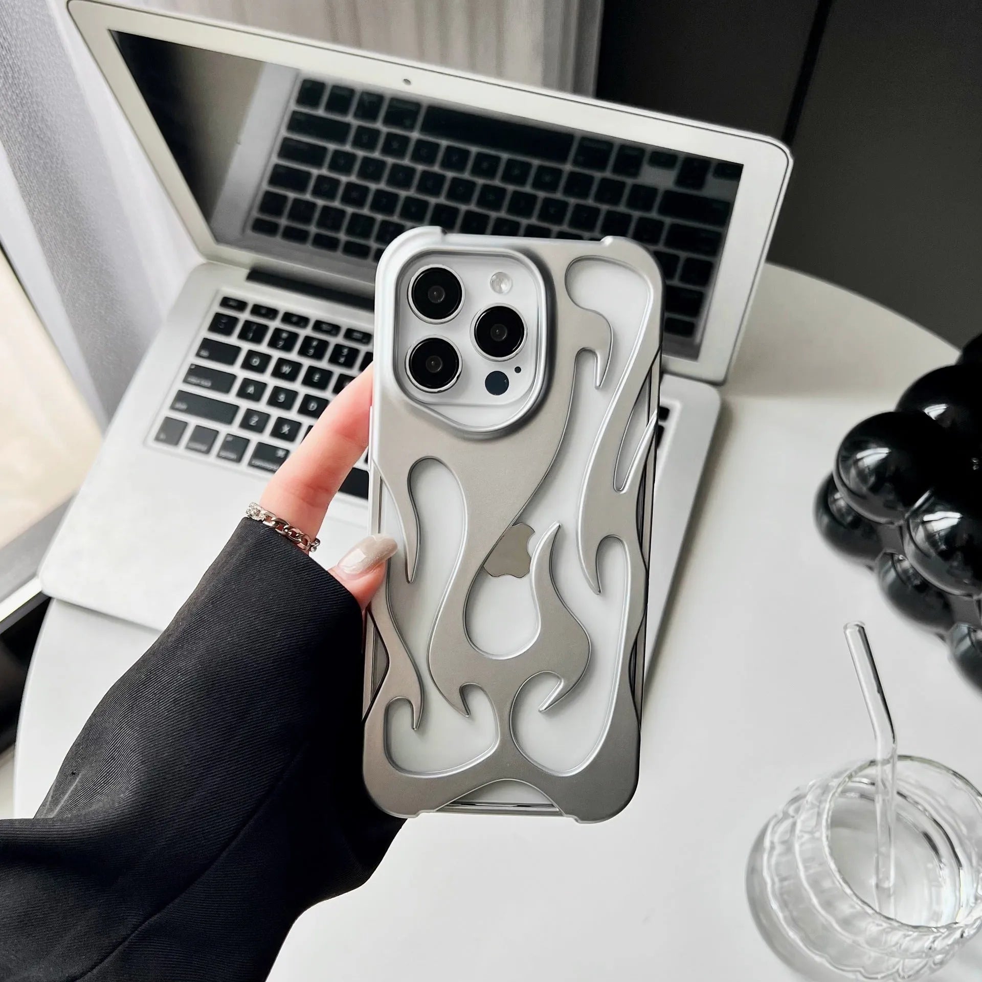 Electroplated hollow flame pattern iPhone case in silver with TPU soft shell construction