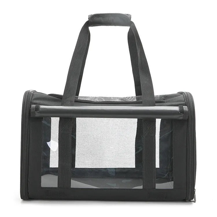 Outdoor portable pet bag in black with transparent panels and mesh sides, folded and shown next to a cat