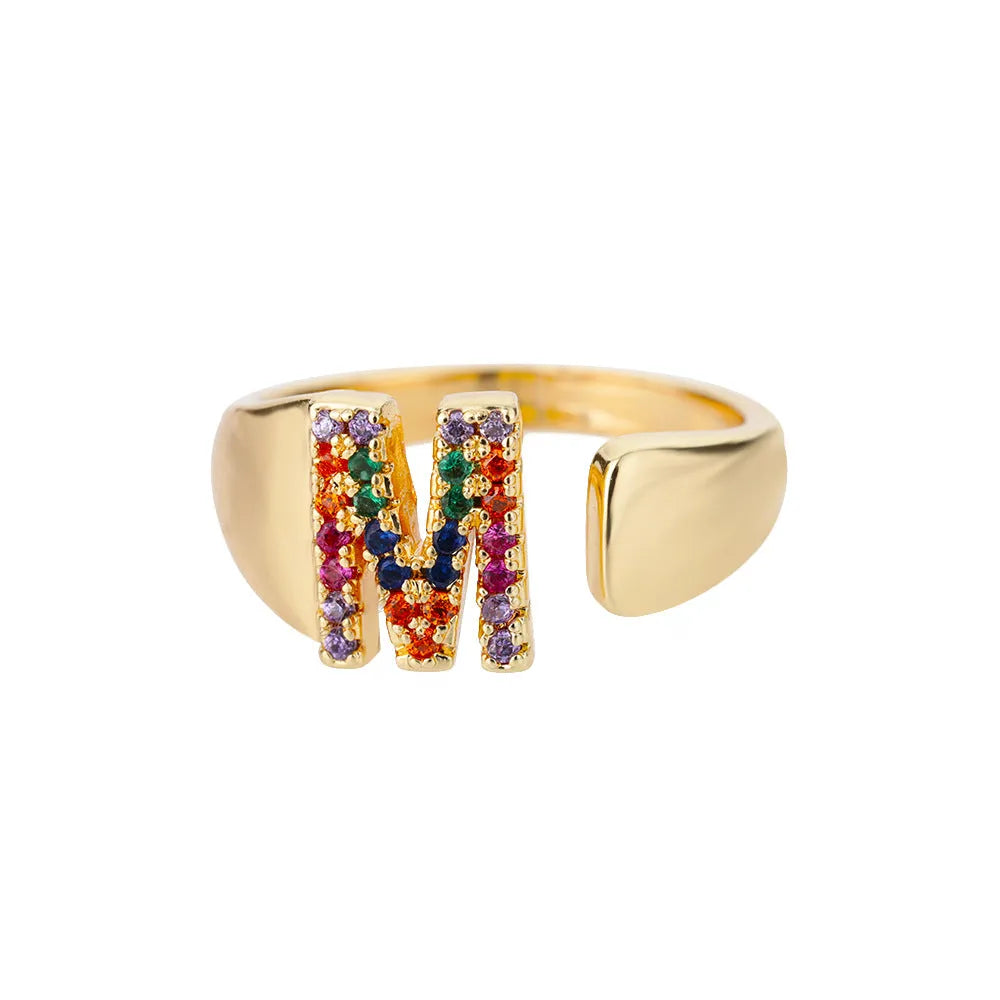 Fashion micro-set colored zirconium adjustable open ring showing letter A on a copper electroplated base