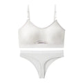 Women's contrast back sports bra vest and briefs set in black with underwire and padding.