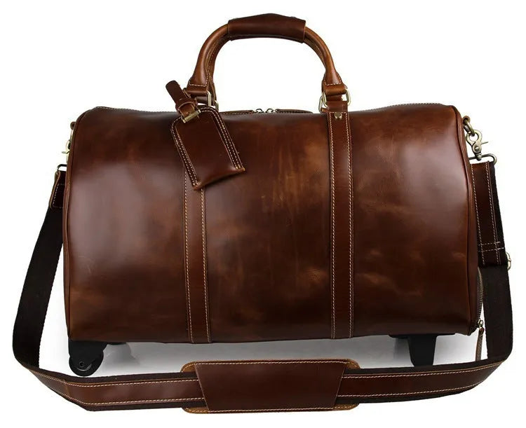21 inch cowhide leather trolley bag in brown glossy finish, front view showing handle and wheels