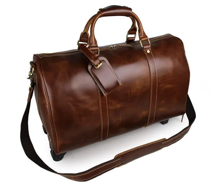 21 inch cowhide leather trolley bag in brown glossy finish, front view showing handle and wheels