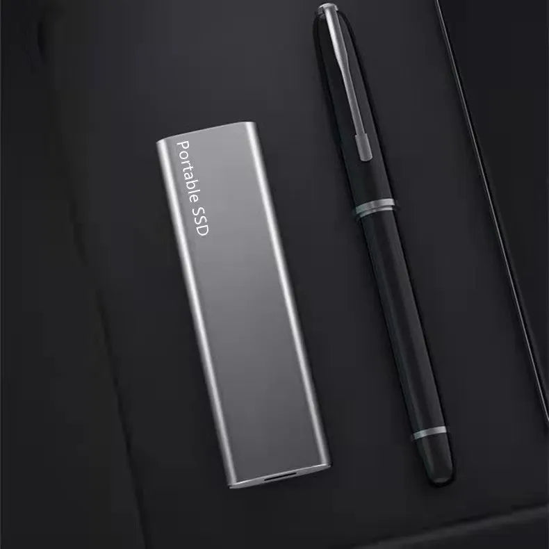 Ultra-thin metal external SSD portable hard drive in red, showing slim profile.