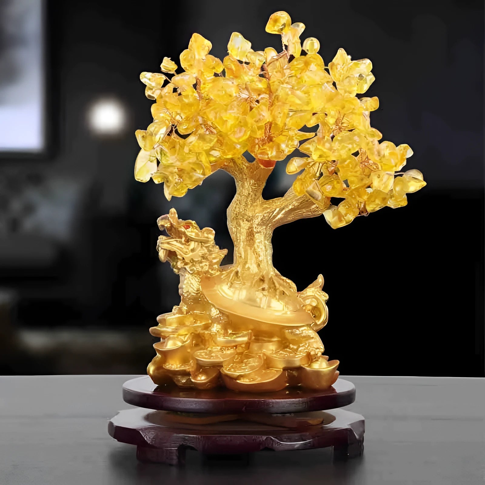 Citrine-coloured resin turtle money tree Feng Shui ornament on display.