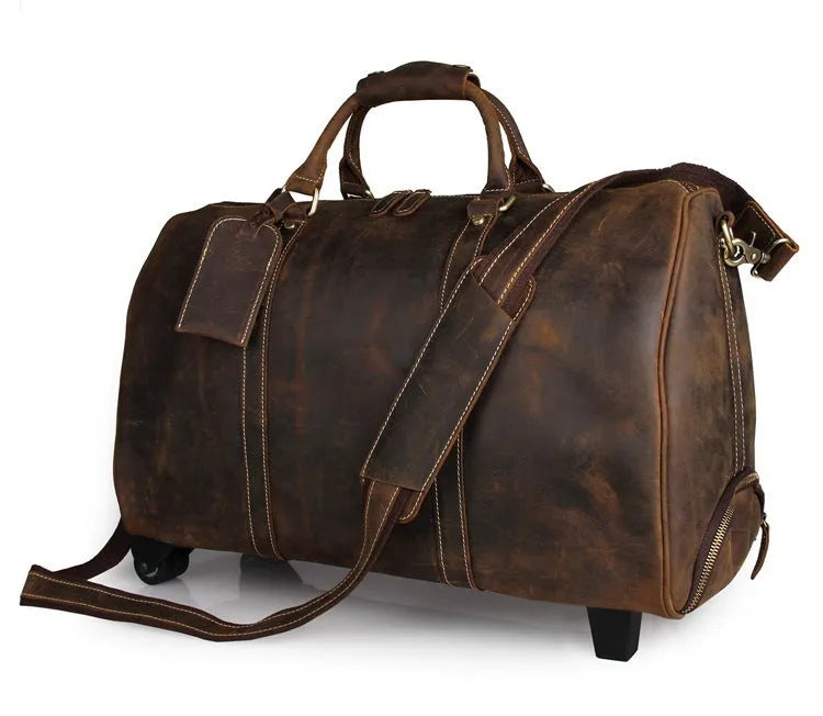 21 inch cowhide leather trolley bag in brown glossy finish, front view showing handle and wheels