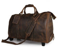21 inch cowhide leather trolley bag in brown glossy finish, front view showing handle and wheels
