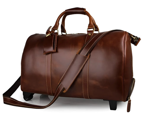 21 inch cowhide leather trolley bag in brown glossy finish, front view showing handle and wheels