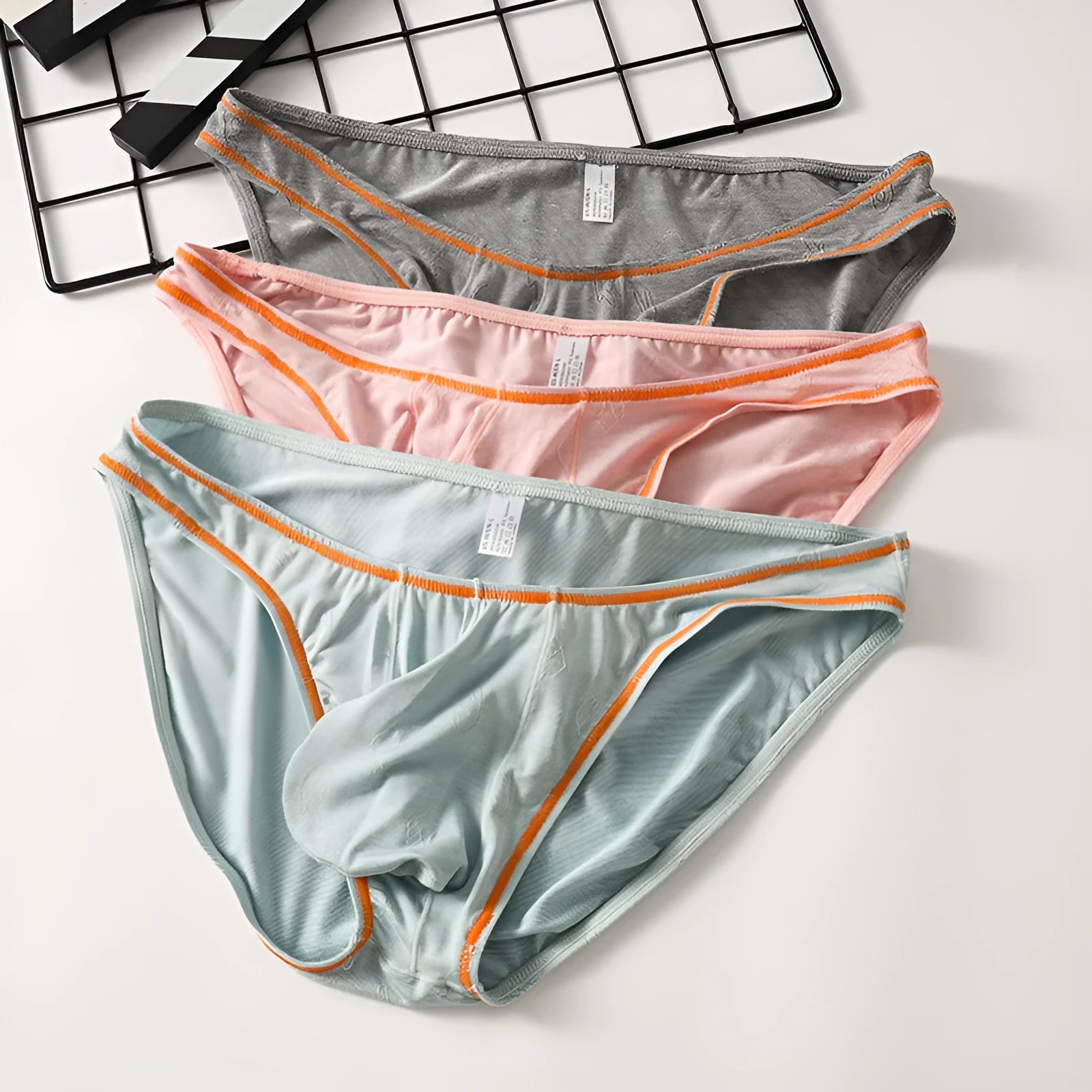 Men's modal butt-lift underwear in dark gray, knitted fabric, shown flat.