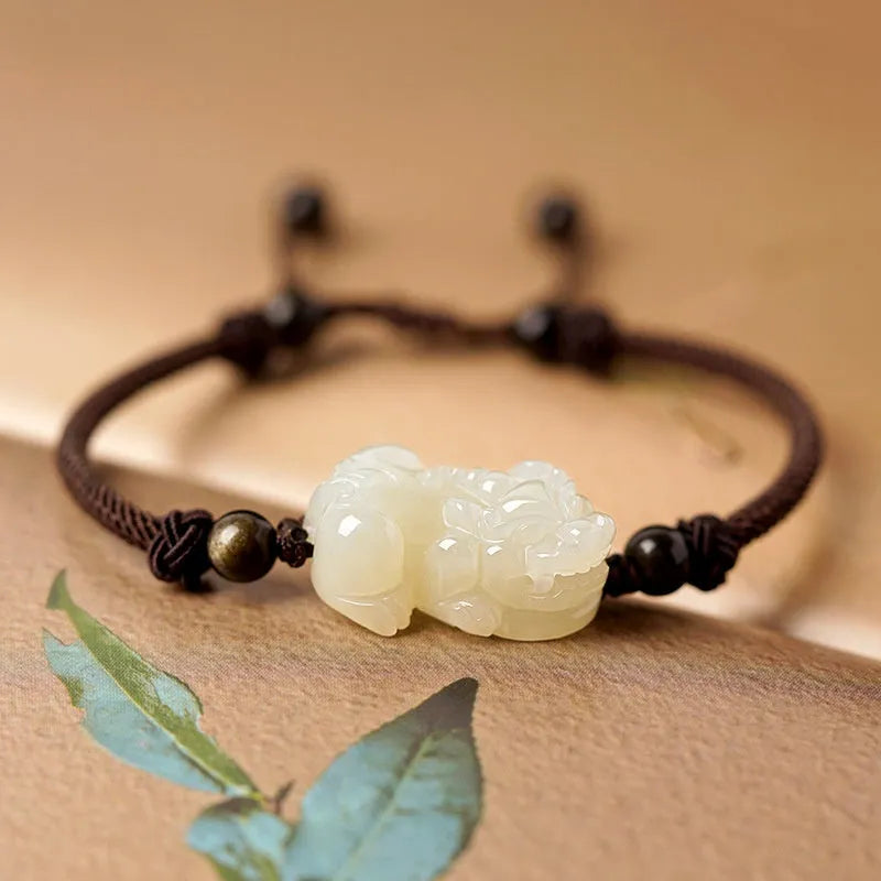 Hetian jade bracelet with braided rope closure in traditional Chinese style