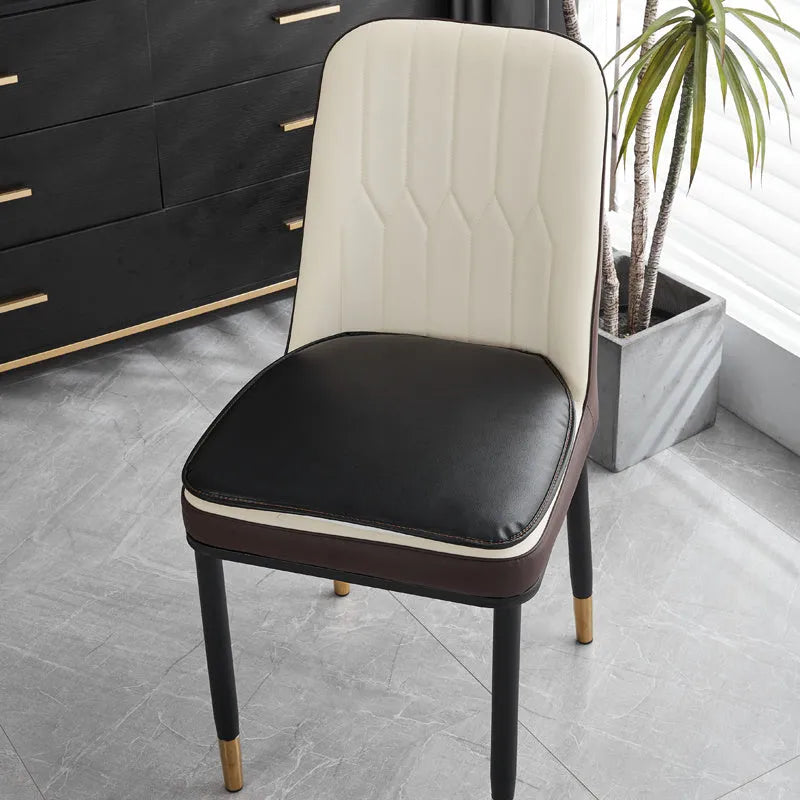 Beige leather horseshoe-shaped seat cushion with anti-slip base on a wooden chair
