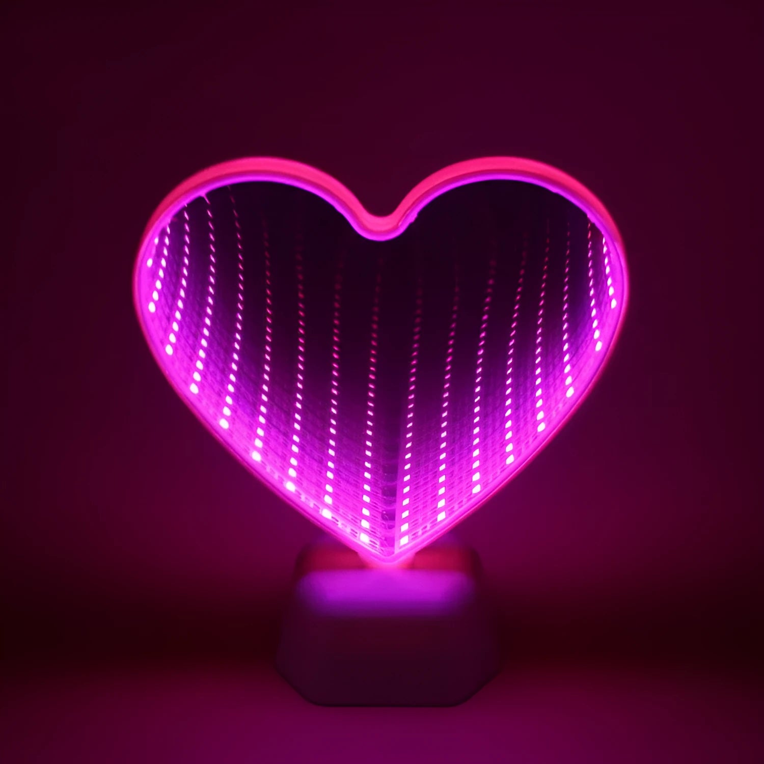 Plastic double-sided LED love tunnel light in rose red or dolphin colour, measuring 16cm long.
