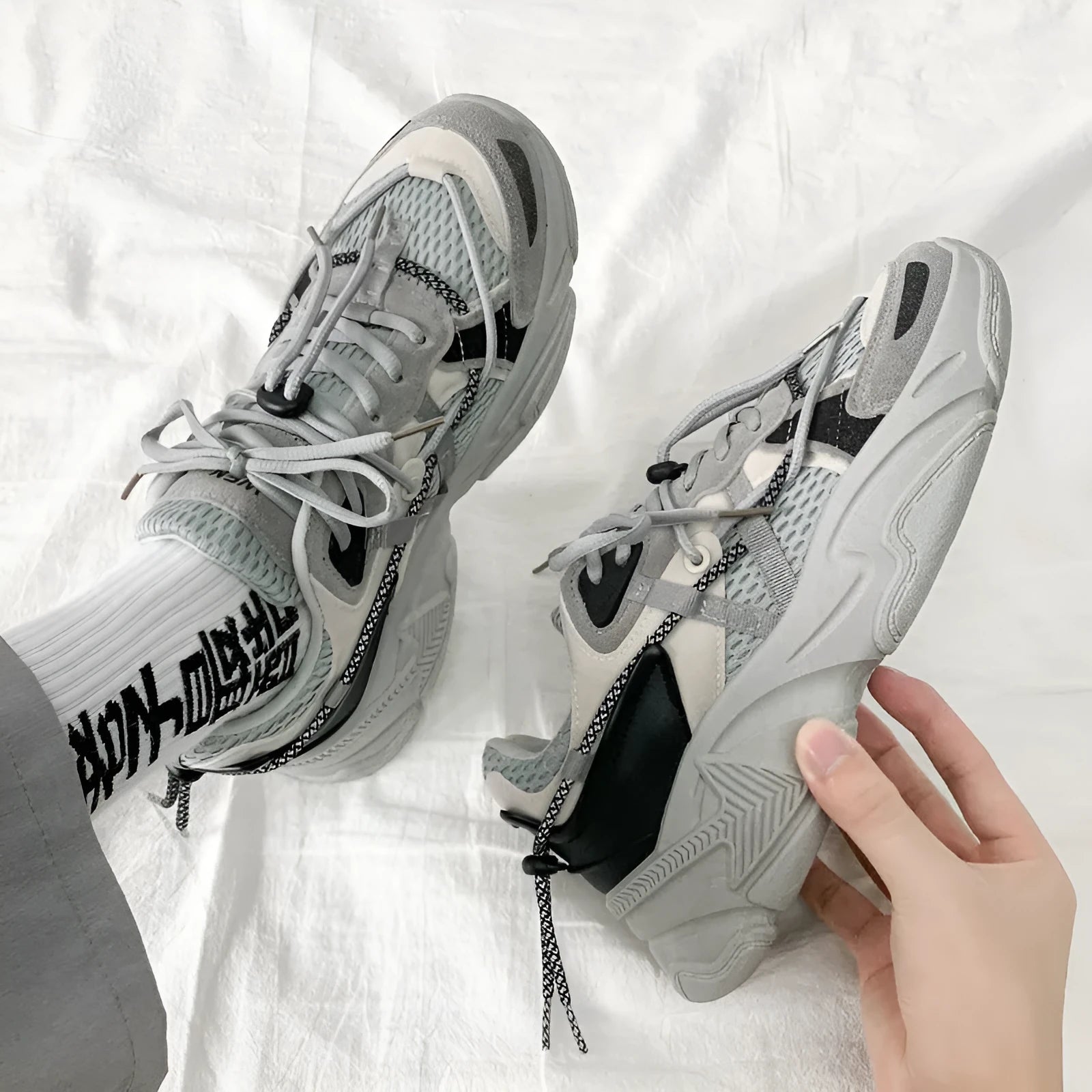 Men's white platform dad shoes with lace-up front, shown on a light background