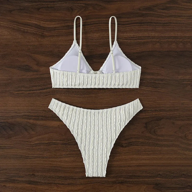 White women's V-neck beach swimsuit two-piece set with sleeveless top and split shorts