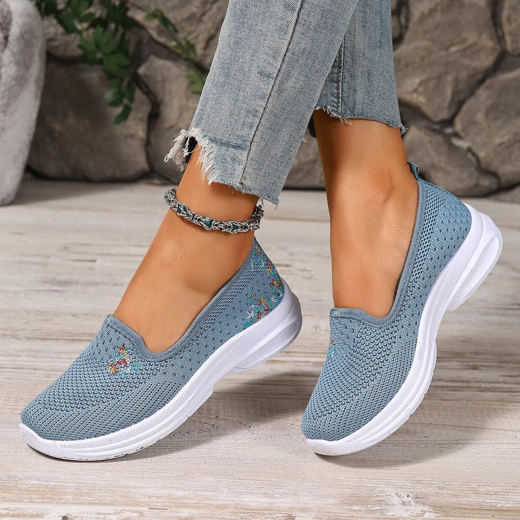 Women's mesh casual slip-on shoes in beige with round toe and low-cut shaft on a plain background