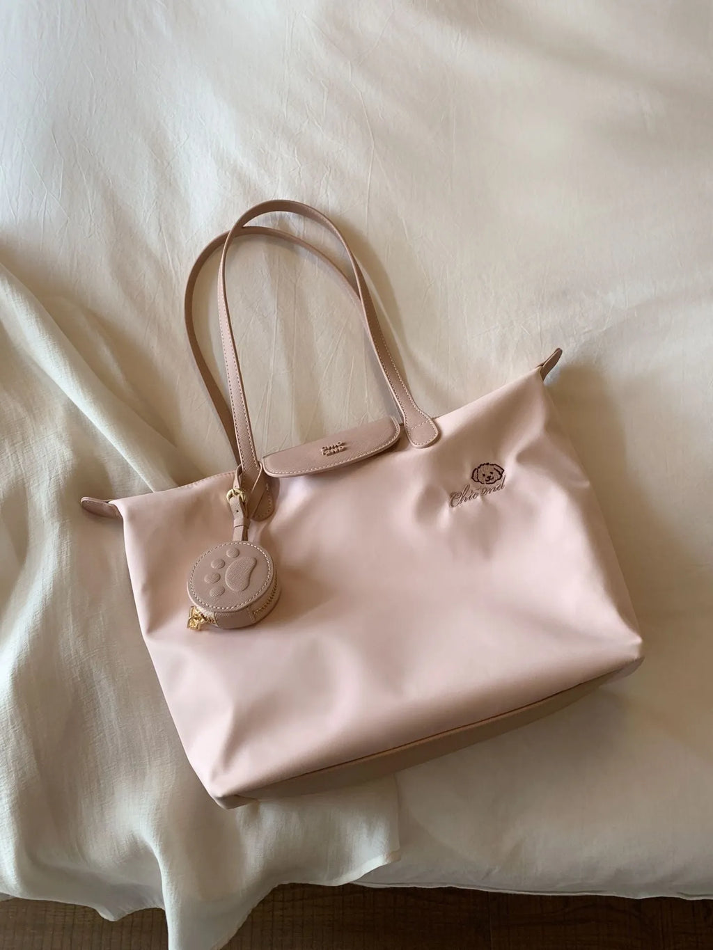 Oxford cloth tote shoulder bag in pink colour with sandwich pocket design and crossbody strap