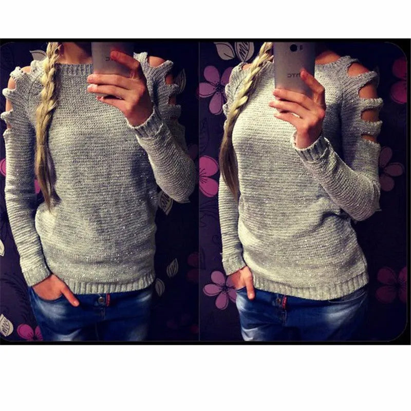 Women's grey crocheted hollow-out long-sleeved shirt with a round neck on a hanger