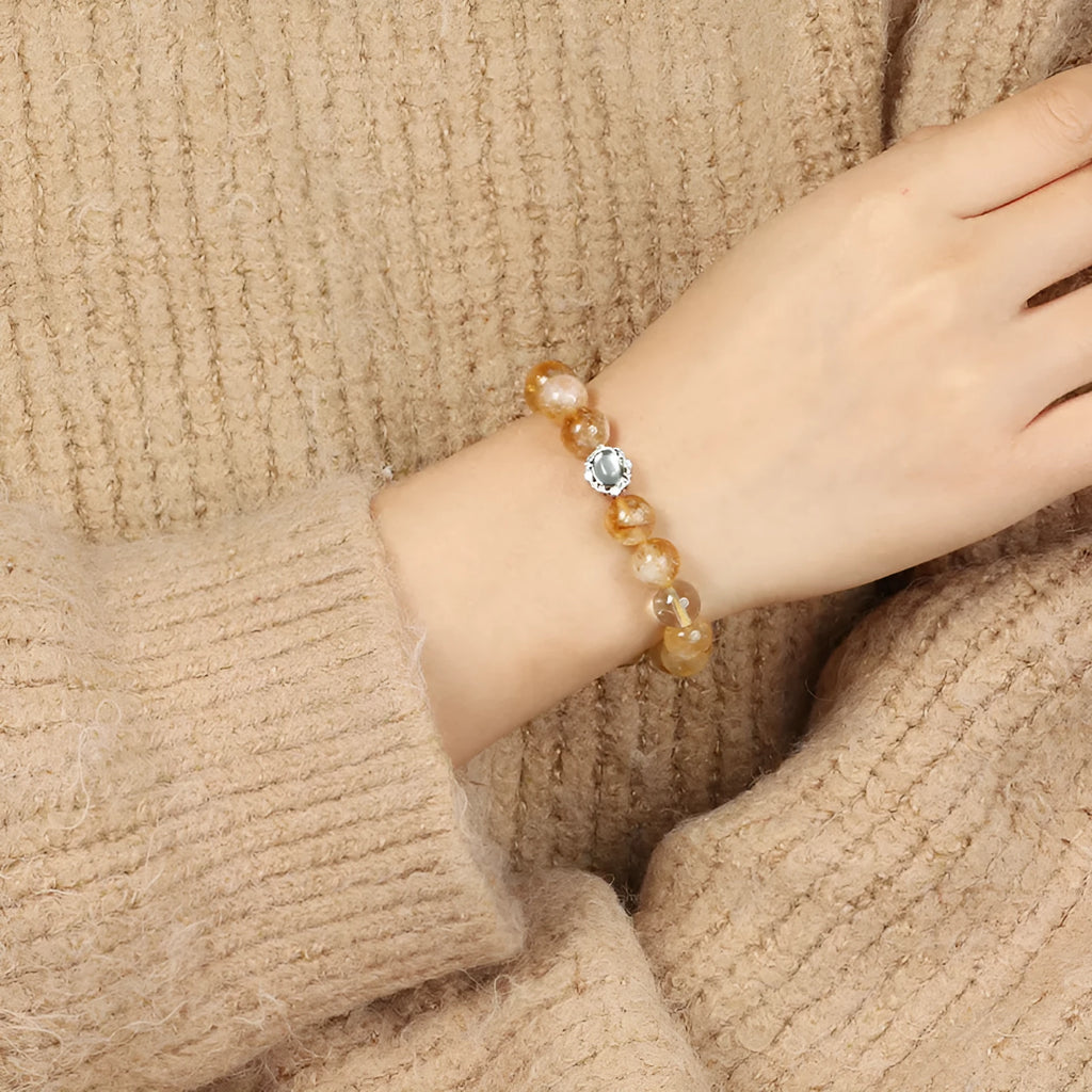 Geometric citrine crystal bracelet with 10mm stones on a metal setting, unisex design.