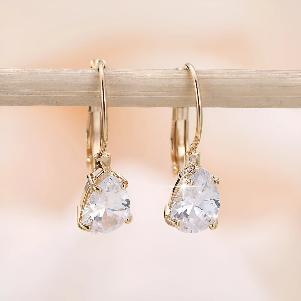 Gold and platinum coloured drop-shaped fashion earrings with metallic finish