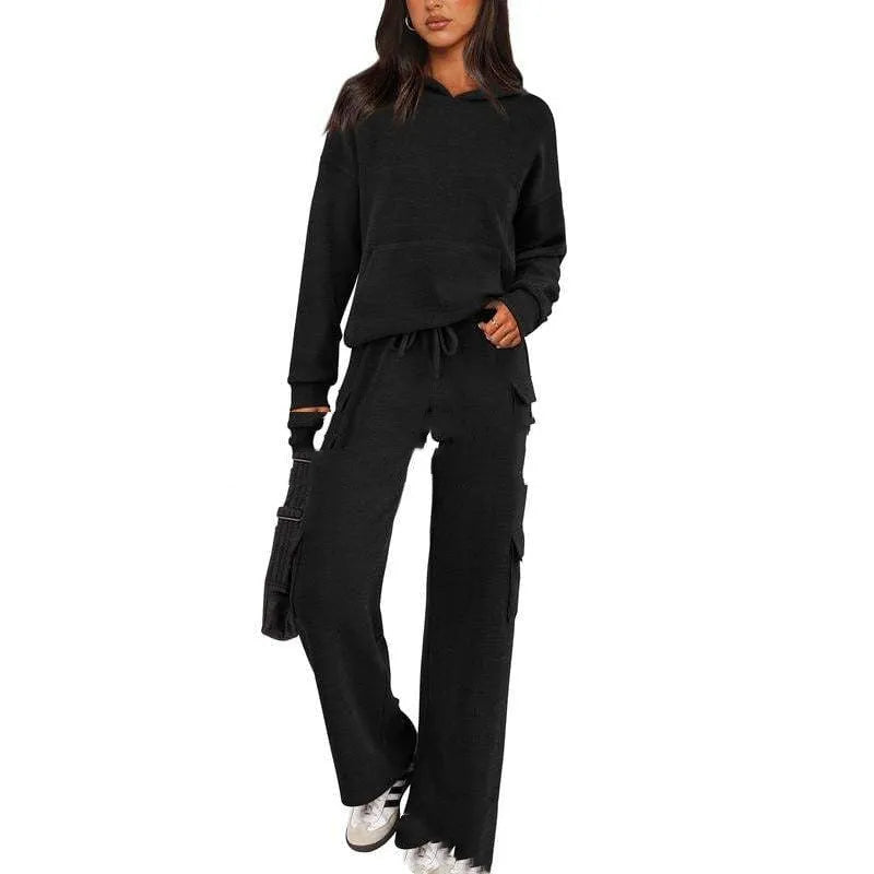 Women's long sleeve leisure sport suit top and trousers set in polyester fabric.