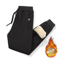 Men's gray fleece-lined track pants with drawstring waist in oversized fit