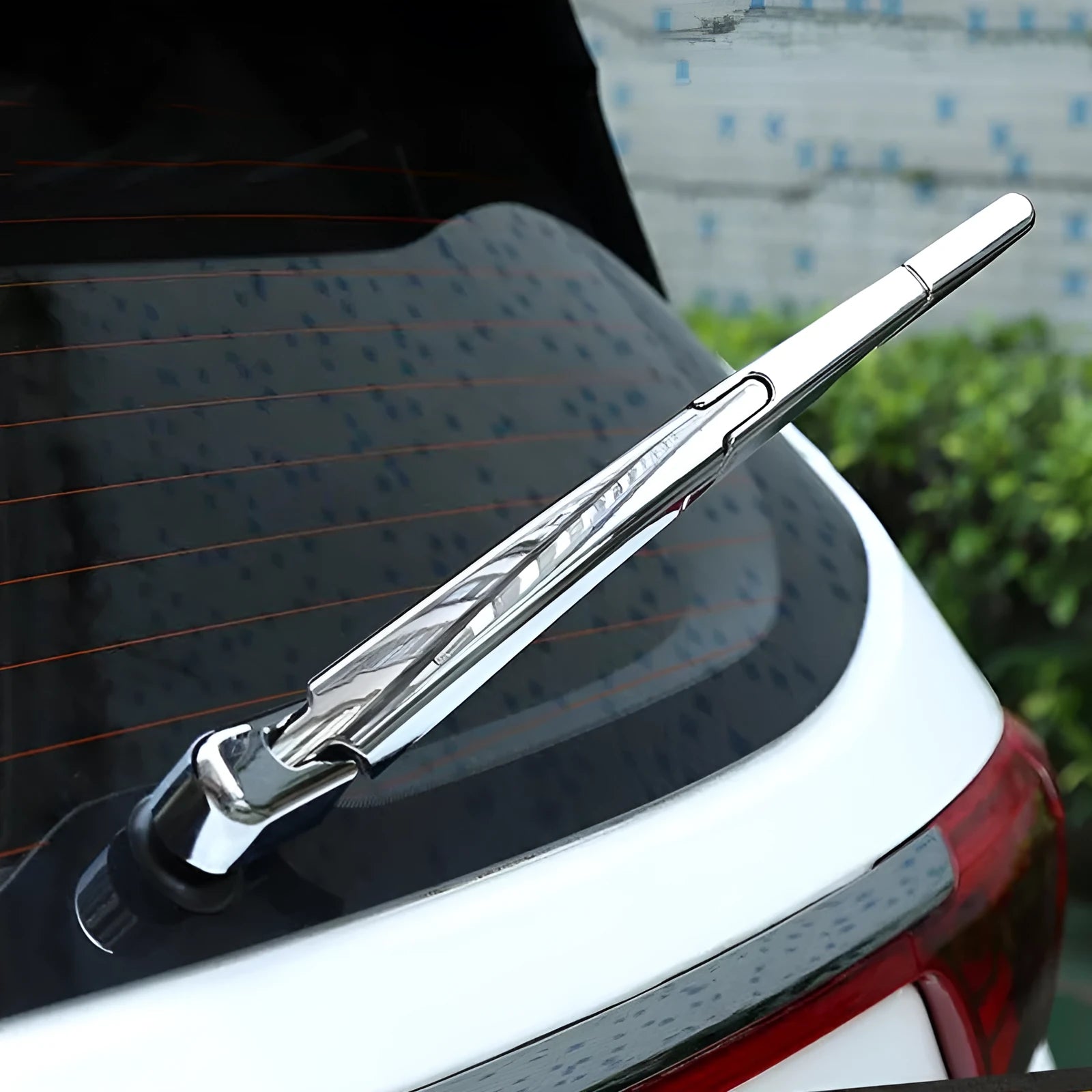 Set of four silvery ABS plastic rear window wiper cover trims for a 2010 Hyundai.