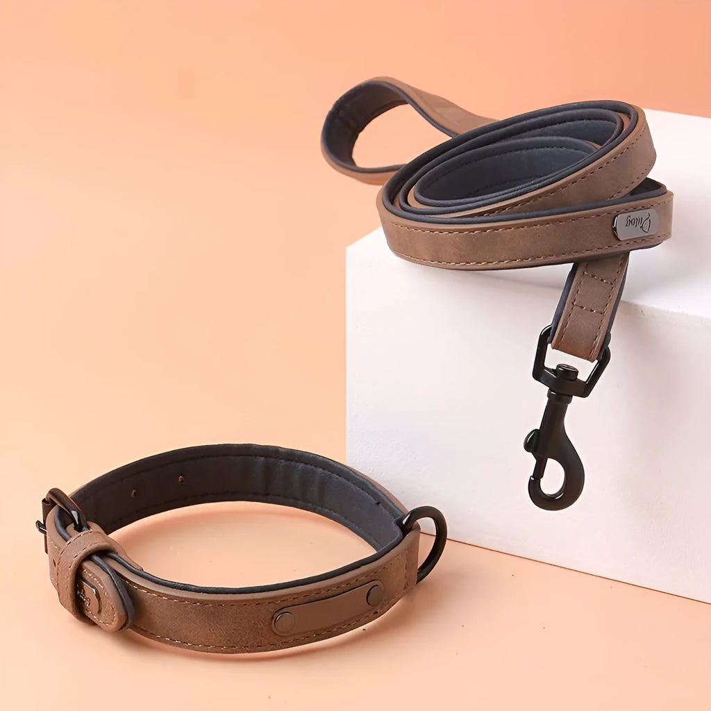 Adjustable dog collar in purple showing front PU material and back microfiber fabric, with a secure buckle closure.