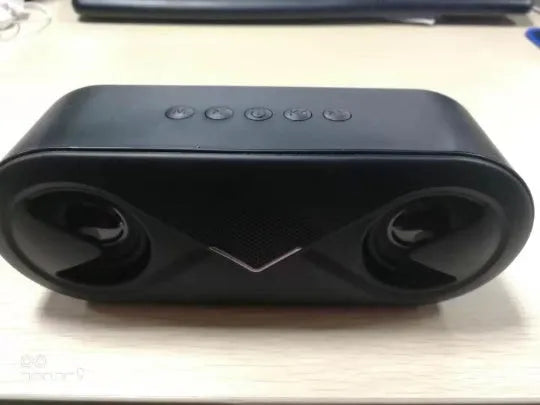 Black Bluetooth speaker with button controls and TF card slot on front