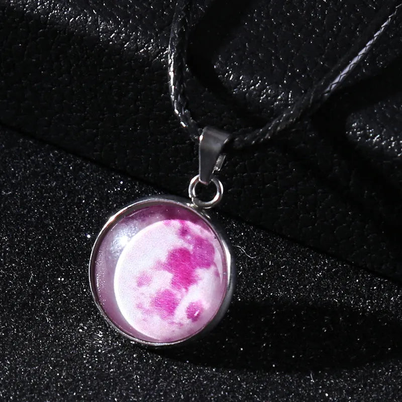 Luminous constellation pendant necklace with adjustable chain on a plain background.