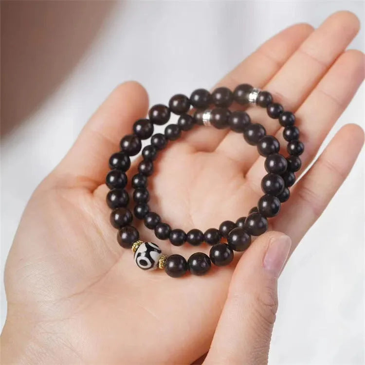 Ebony bracelet with Tibet beads design showing two-tone colour circles and 8mm diameter