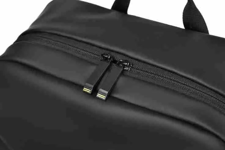 Large capacity waterproof backpack in black blue or grey colours made from PU leather with simple design