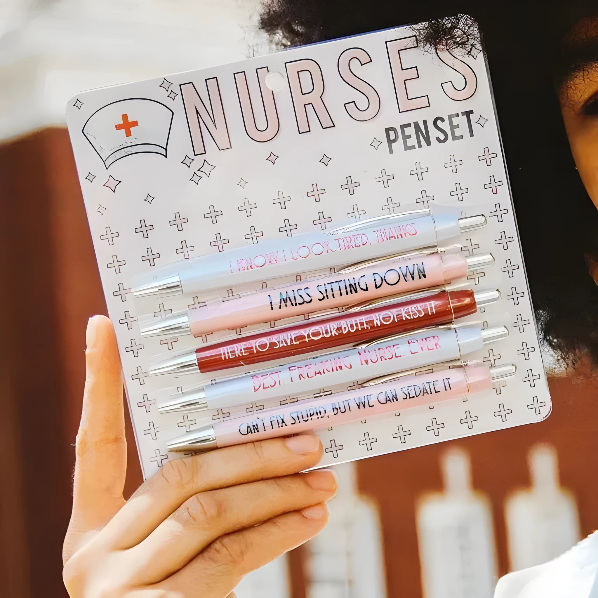 Five nurse-themed retractable ballpoint pens showing plastic construction and medical humour design elements