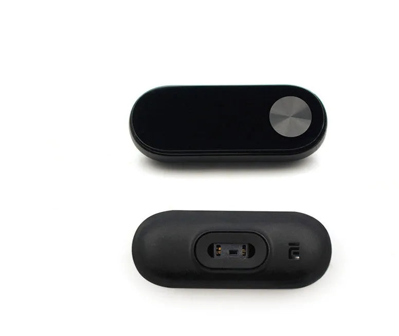 Xiaomi Mi Band 2 black fitness tracker on wrist showing OLED display