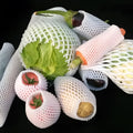 White foam fruit protective net cover showing shockproof design for produce protection