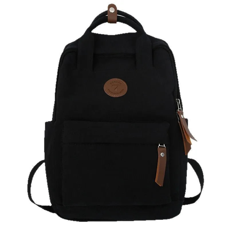 Black Oxford cloth backpack with curved shoulder straps and retro urban style detailing