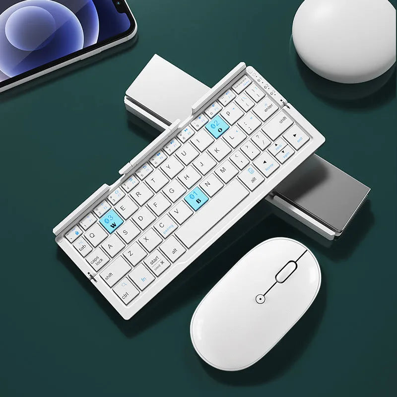 Silver white folding Bluetooth keyboard open with phone on stand and closed showing compact size