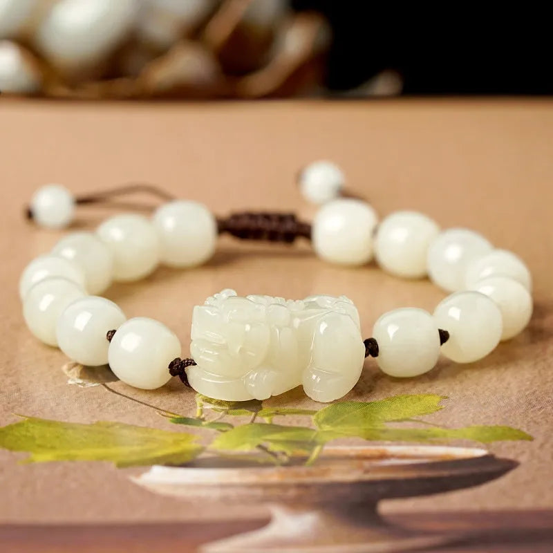 Hetian jade bracelet with braided rope closure in traditional Chinese style