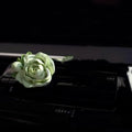 Solid jasmine car perfume for air vent with gypsum base and essential oil bottle in beige white or green.