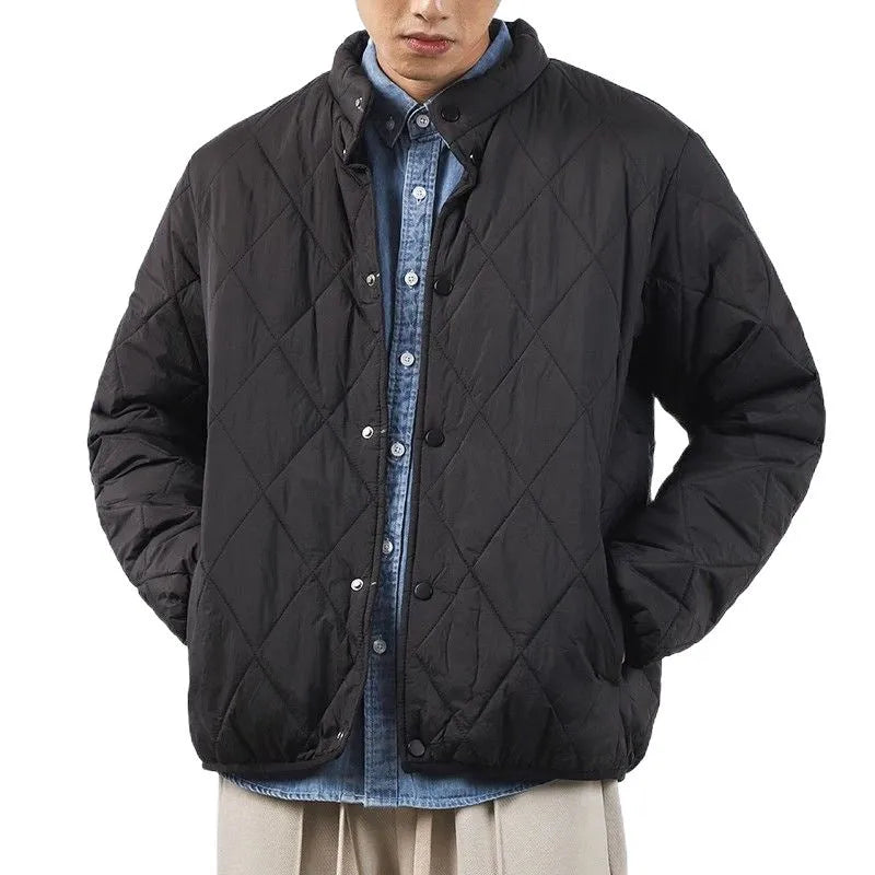 Men's black diamond quilted winter jacket with a loose, longline fit and zip-up front.