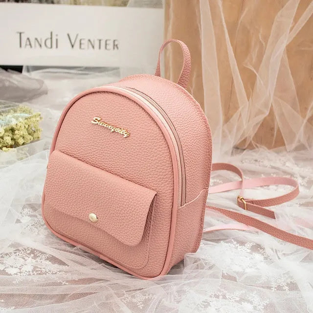 Women's small black PU leather backpack letter purse with shoulder strap measuring 18.5cm long