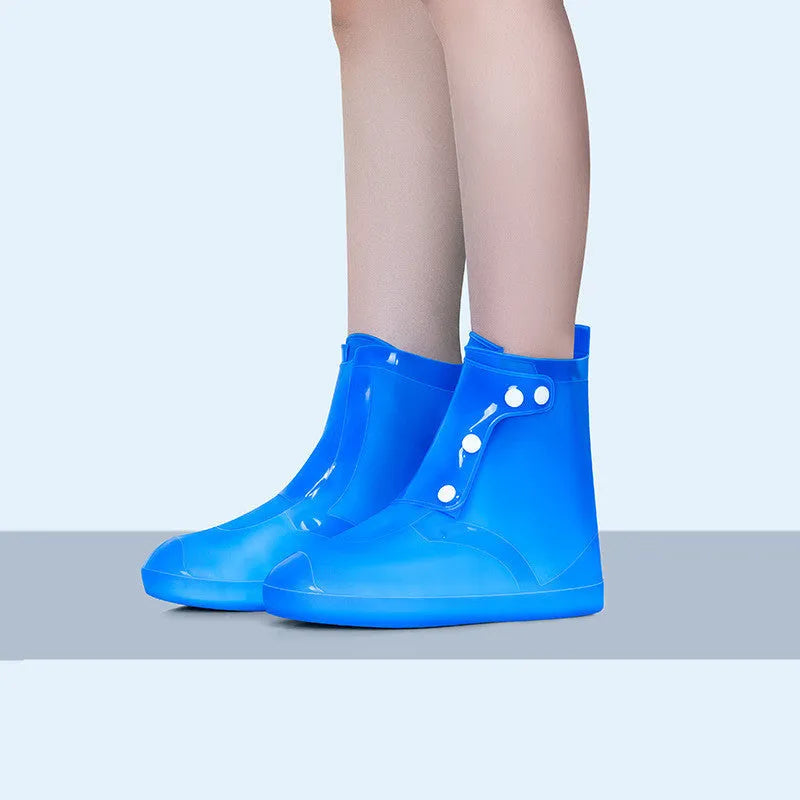White PVC high top women's water resistant shoe covers with anti-skid soles shown in size options